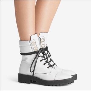 Lexy Snow Vigo Stuart Weitzman lace up combat boots.